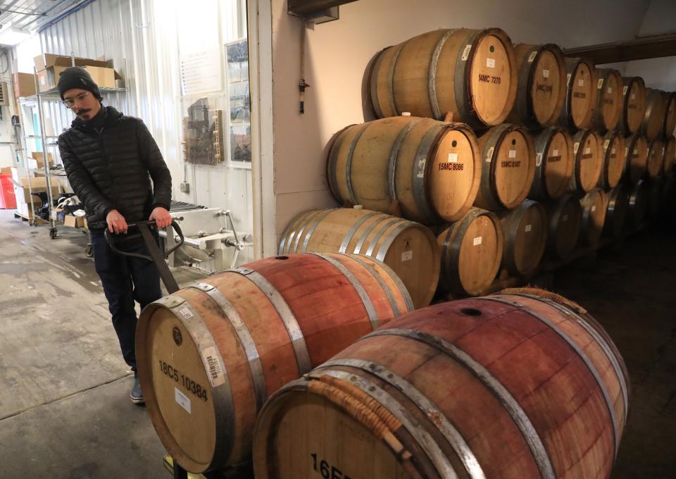 Cellar master, Sava Marinkovic, moves empty wine barrels to be cleaned at Millbrook Vineyards & Winery on February 22, 2024.