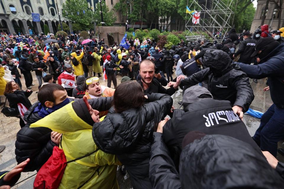 Riot police disperse protesters outside Georgian parliament after ...