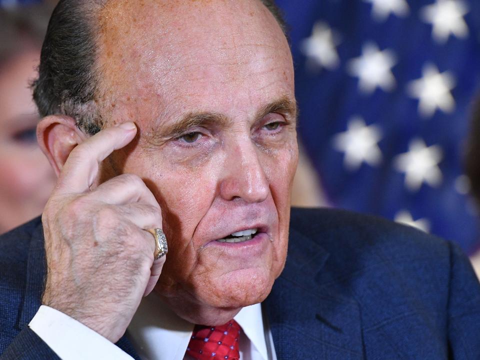 <p>Rudy Giuliani speaks during a press conference at the Republican National Committee headquarters in Washington, DC, on 19 November 2020</p> ((AFP via Getty Images))