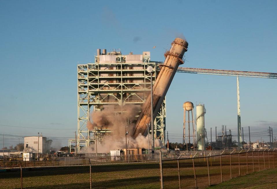 Lakeland Electric's Unit 3 at the McIntosh Power Plant is seen in a time lapse during the demolition and implosion of the structure Saturday morning.