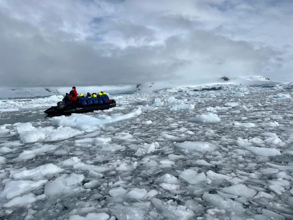 Passengers on a zodiac boat.