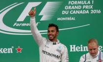 Formula One - Canadian Grand Prix - Montreal, Quebec, Canada - 12/6/16 - Mercedes driver Lewis Hamilton celebrates winning the race. REUTERS/Chris Wattie