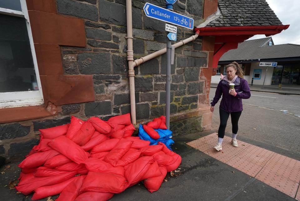 Sand bags sit piled against a wall in the main street in Aberfoyle in Perthshire (Andrew Milligan/PA Wire)