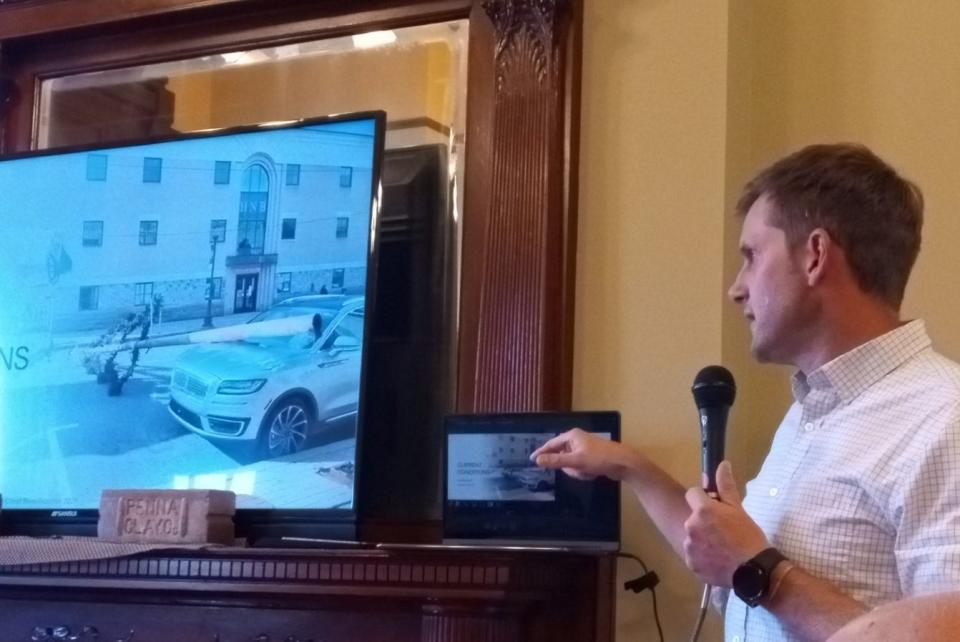 As a example of the need to upgrade public safety in downtown Honesdale, Jayson Wood of Woodland Design Associates showed borough council on April 22, 2024, a picture of the time on Nov. 19, 2021, when one of the steel electric light poles holding a Christmas tree decoration broke in a windstorm and collapsed on a parked car on Main Street. PPL subsequently replaced rusted poles, and Greater Honesdale Partnership stored away the Christmas trees that were meant to decorate the street that holiday season.