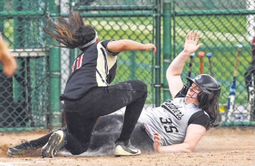 Bridgewater-Raritan’s Deanna Centi is tagged out at home by Hillsborough’s Katie Godemsky during Saturday, May 10, 2014’s game.