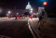 <p>Members of the US National Guard deploy around the US Capitol on January 12, 2021 in Washington, DC.</p>