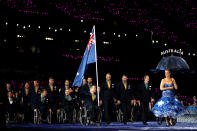 LONDON, ENGLAND - AUGUST 29: Wheelchair rugby player Greg Smith of Australia carries the flag during the Opening Ceremony of the London 2012 Paralympics at the Olympic Stadium on August 29, 2012 in London, England. (Photo by Clive Rose/Getty Images)