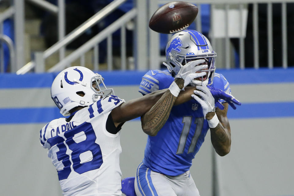 Indianapolis Colts cornerback T.J. Carrie (38) deflects a pass intended for Detroit Lions wide receiver Marvin Jones (11) during the second half of an NFL football game, Sunday, Nov. 1, 2020, in Detroit. (AP Photo/Duane Burleson)