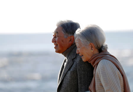FILE PHOTO : Japan's Emperor Akihito and Empress Michiko stroll on a beach near their imperial villa, where they are staying for the emperor's recuperation, in Hayama town, south of Tokyo, Japan January 21, 2019. REUTERS/Issei Kato/File Photo