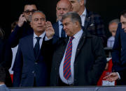 FC Barcelona club President Joan Laporta, center, gestures at the stand before a Spanish La Liga soccer match between Barcelona and Rayo Vallecano at the Olimpic Lluis Companys stadium in Barcelona, Spain, Sunday, May 19, 2024. (AP Photo/Joan Monfort)