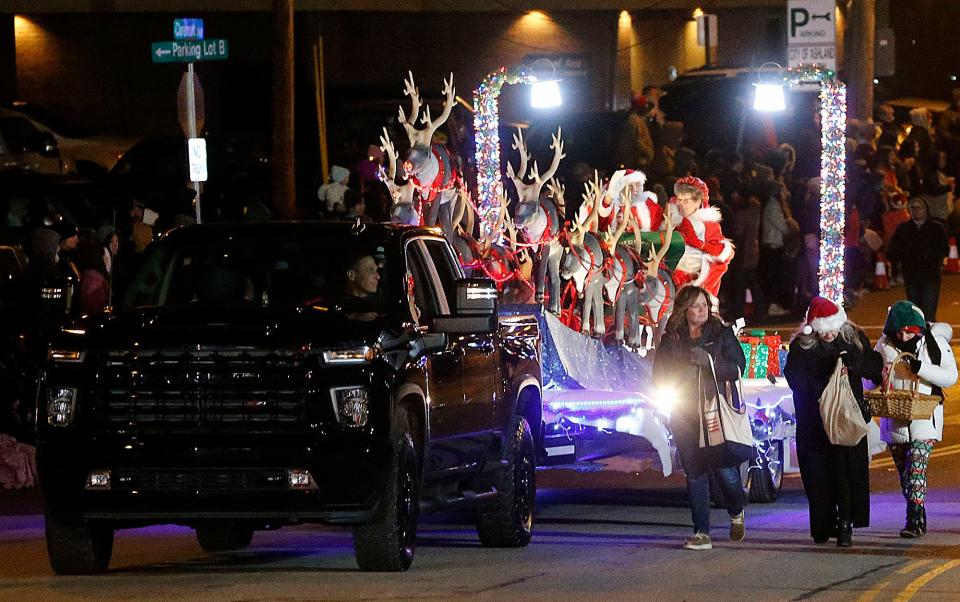 Santa and Mrs. Claus head down Claremont Avenue to W. Main Street on their float in Ashland's annual Christmas parade held Saturday, Dec. 3, 2022. TOM E. PUSKAR/ASHLAND TIMES-GAZETTE