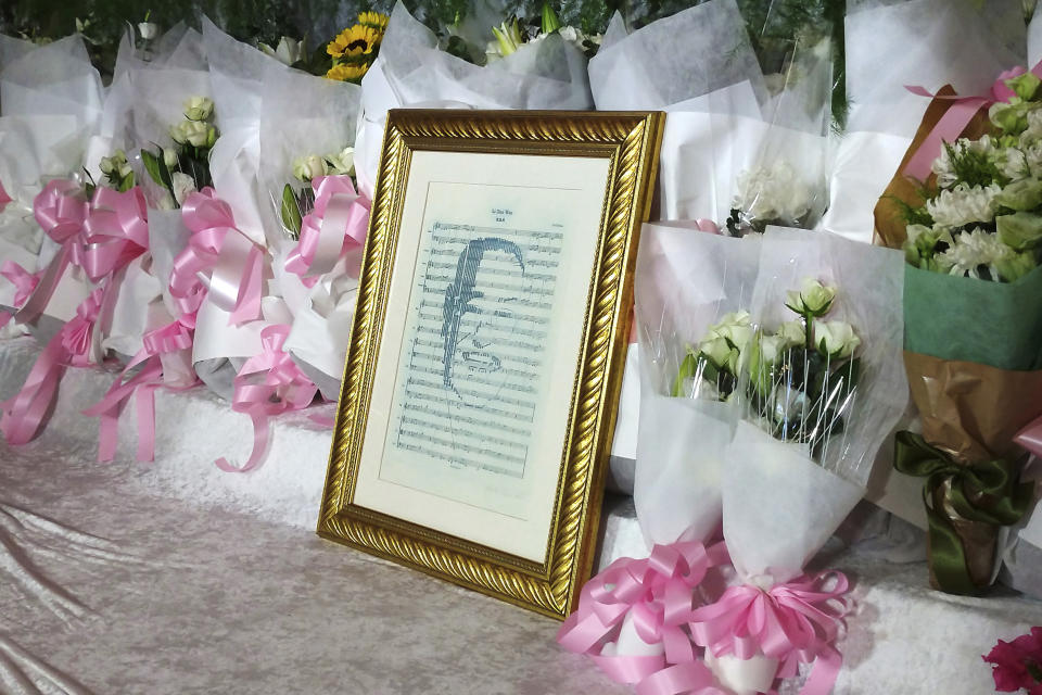 A portrait of the late former President Lee Teng-hui is placed with flowers at his memorial in Taipei, Taiwan, Saturday, Aug. 1, 2020. Lee, who brought direct elections and other democratic changes to the self-governed island despite missile launches and other fierce saber-rattling by China, died on Thursday at age 97. (AP Photo/Chiang Ying-ying)