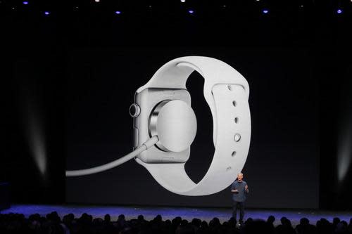 Tim Cook onstage with the screen showing the Apple Watch charging