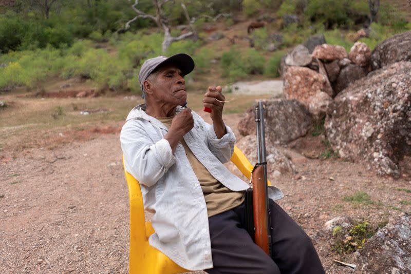 The Wider Image: "Under siege": Inside Mexican village where children are armed