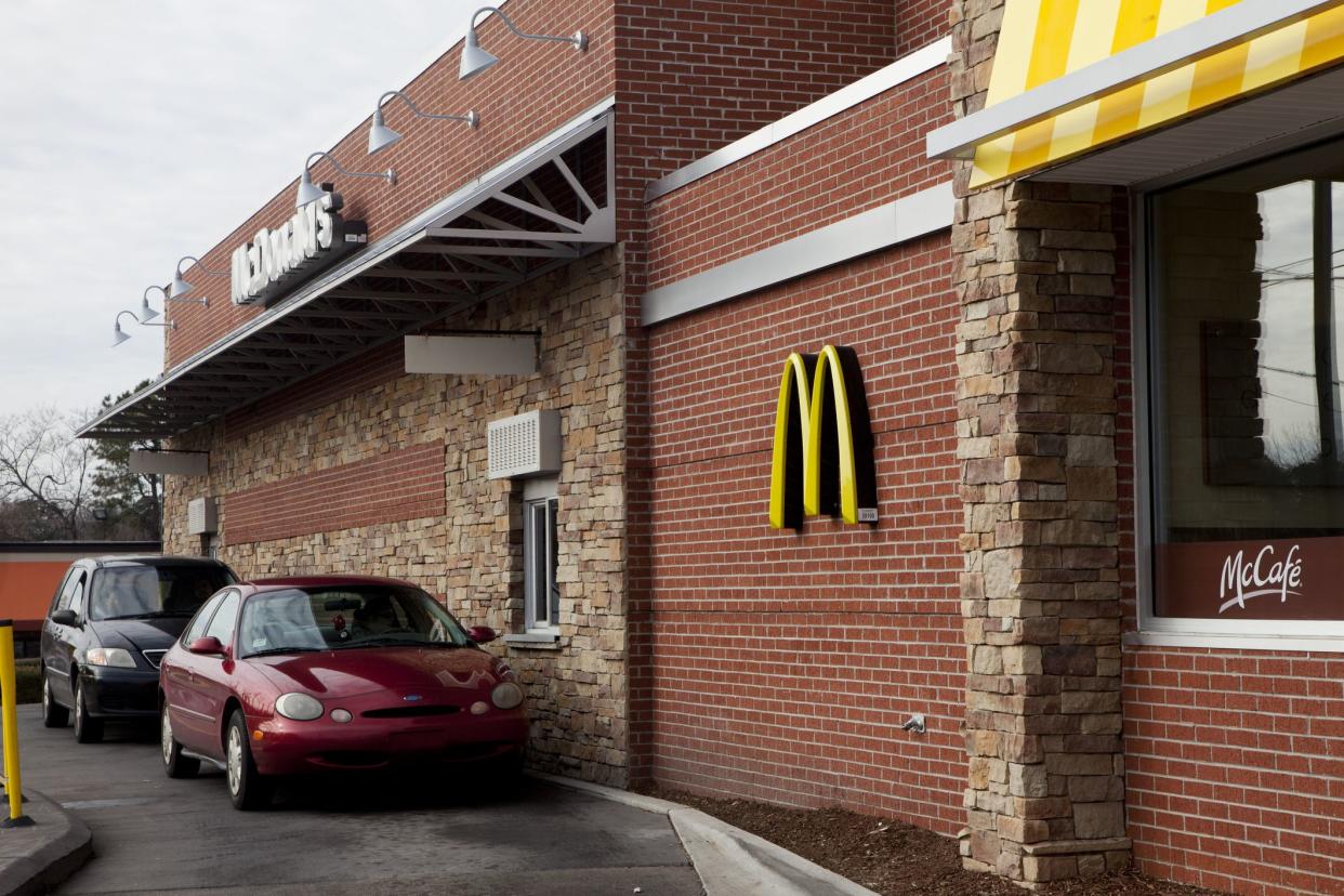 Siler City, NC, USA. January 16th, 2011. McDonalds restaurant during the lunch hour. Cars lined up at drive thru window.
