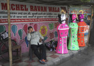 Effigies of mythical demon king Ravana stand for sale by the side of a road ahead of Hindu festival Dussehra, in New Delhi, India, Friday, Oct. 23, 2020. So far, the colorful and elaborate rituals in the festival season have been scaled down because of the coronavirus pandemic. The celebrations have become muted. The towering displays of religious sculptures are rare, and at many places, prayers have gone virtual, with organizers live streaming the sessions for the devotees. (AP Photo/Manish Swarup)