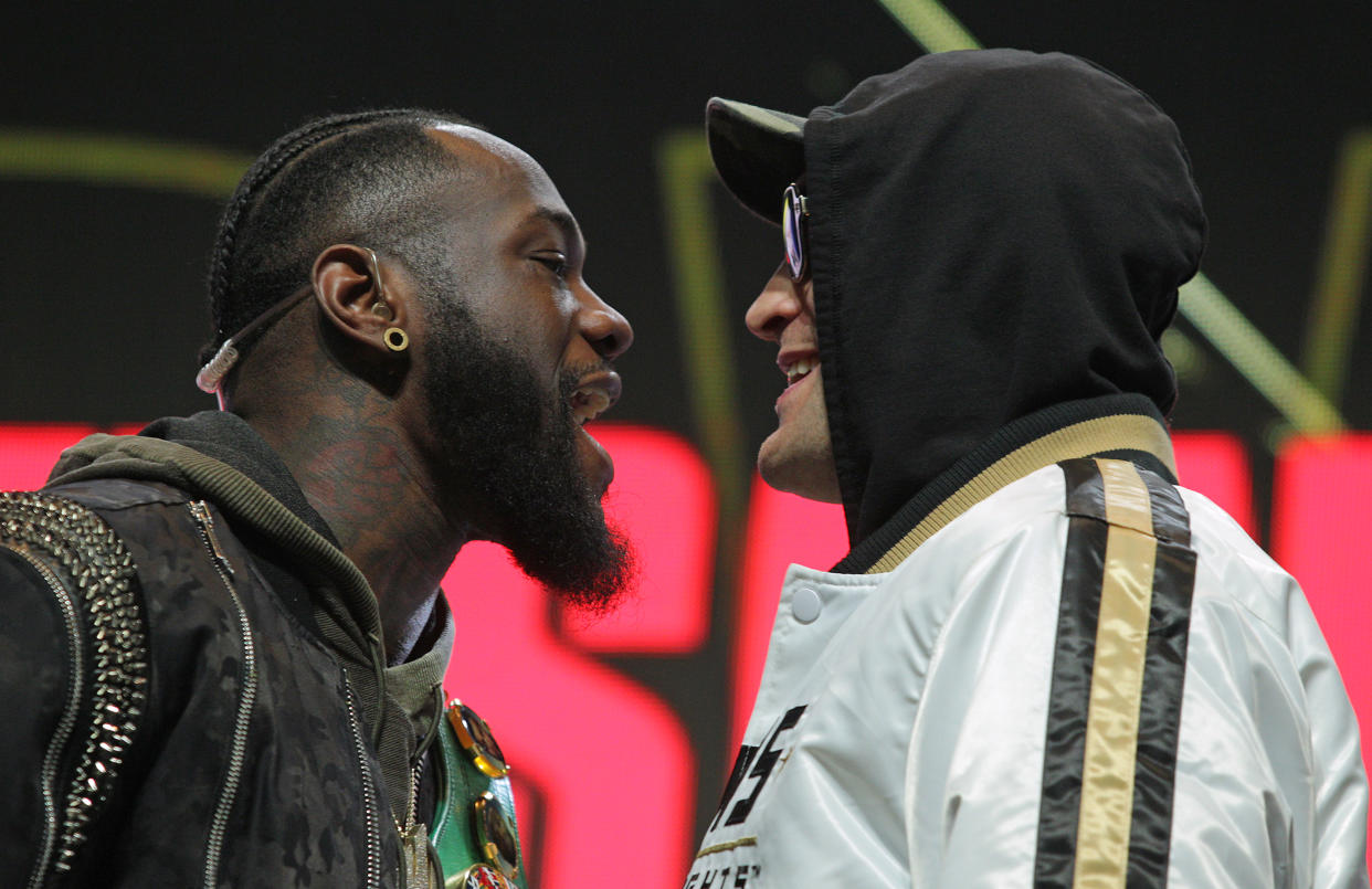 US boxer Deontay Wilder (L) and British boxer Tyson Fury get into an altercation during their press conference February 19, 2020 at the MGM Grand Las Vegas in Las Vegas, Nevada. - The boxers will fight for the World Boxing Council (WBC) Heavyweight Championship Title on February 22, 2020 at the MGM Grand Garden Arena in Las Vegas. (Photo by John Gurzinski / AFP) (Photo by JOHN GURZINSKI/AFP via Getty Images)