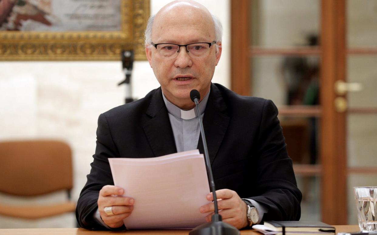 Chilean bishop Luis Fernando Ramos Perez reads a statement during a news conference after a meeting with Pope Francis at the Vatican - REUTERS