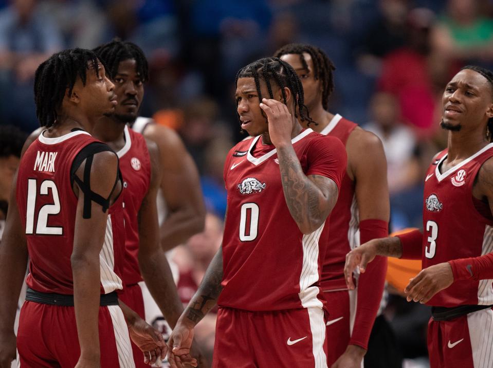 Arkansas Razorbacks guard Khalif Battle (0) recovers from a South Carolina foul during their second round game of the SEC Men's Basketball Tournament at Bridgestone Arena in Nashville, Tenn., Thursday, March 14, 2024.