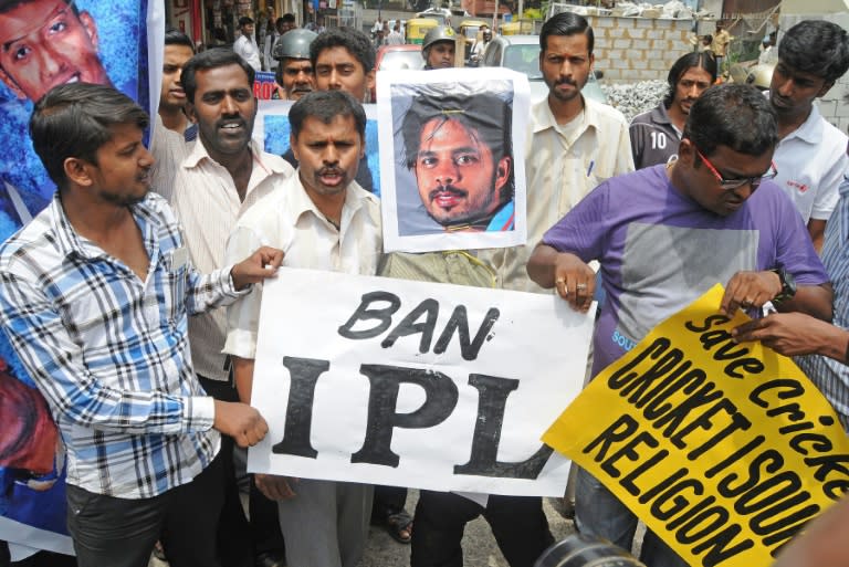 Demonstrators hold posters and shout slogans against Indian cricketer Sreesanth and two other domestic Twenty20 cricketers during a protest against their alleged involvement in match fixing, in Bangalore on May 16, 2013