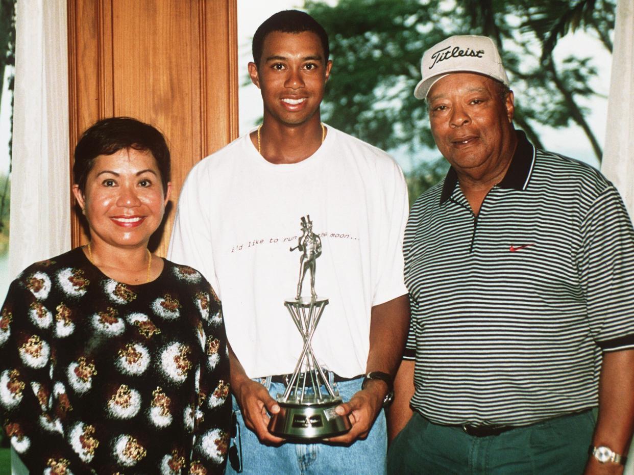 Tiger Woods with his parents Kultida and Earl Woods at the Johnnie Walker Classic at Blue Canyon Golf Club, Thailand