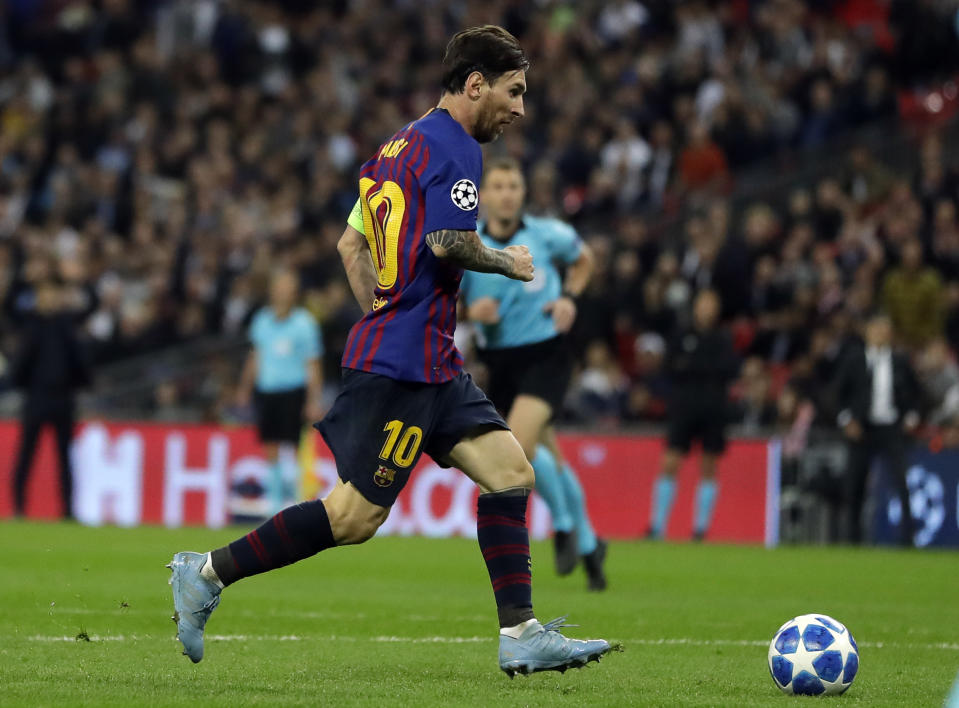 Barcelona forward Lionel Messi scores his side's fourth goal during the Champions League Group B soccer match between Tottenham Hotspur and Barcelona at Wembley Stadium in London, Wednesday, Oct. 3, 2018. (AP Photo/Kirsty Wigglesworth)