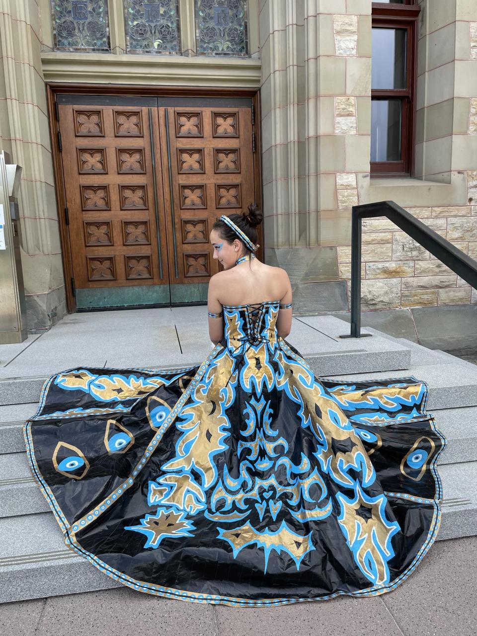Erika Avellaneda poses in duct tape prom dress 2021 (Photo via Stuck At Prom Scholarship Contest)