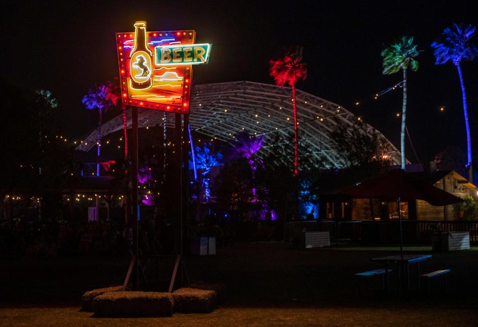 A neon sign for the beer barn is seen during Stagecoach country music festival at the Empire Polo Club in Indio, Calif., Sunday, April 30, 2023. 