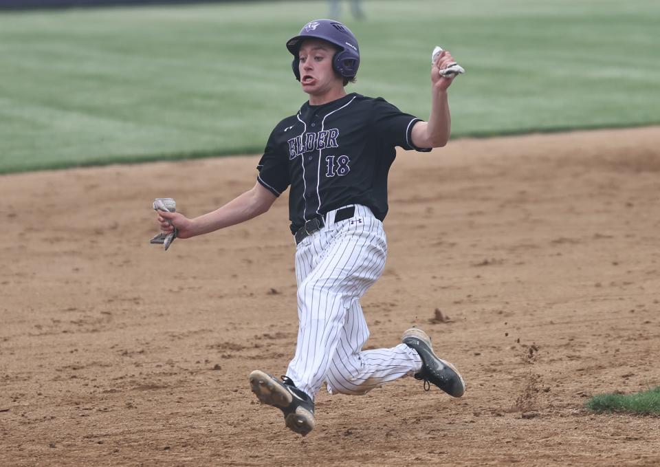 Elder's Brayden Curlis (18) slides into third base during their tournament win over Anderson, Thursday, May 19, 2022.