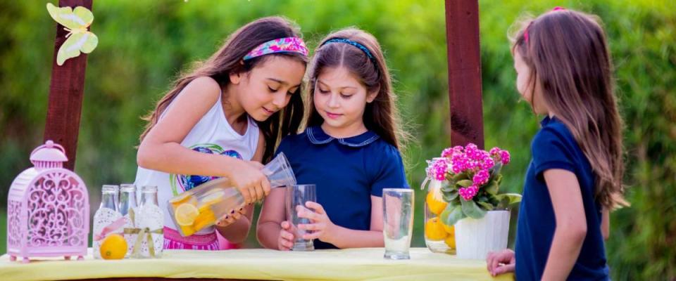 Three young girls at their lemonade stand
