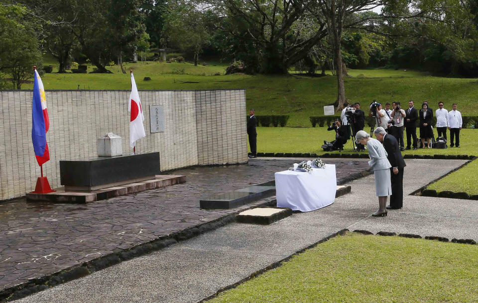 FILE - In this Jan. 29, 2016, file photo, Japan's Emperor Akihito and Empress Michiko bow to pay their respects to the Japanese Imperial Forces who died during WWII at the Japanese Memorial Garden at Cavinti, southeast of Manila, Philippines. Japan’s Emperor Akihito has devoted his 30-year reign to making amends for a war fought in his father’s name, while adapting the 1,500-year-old monarchy’s traditions to draw the Imperial Family closer to the public. Akihito’s subtle public comments and insights from his classmates show him to be determined but also open to new ideas. He’s shown a keen awareness of his duties. (AP Photo/Bullit Marquez, File)