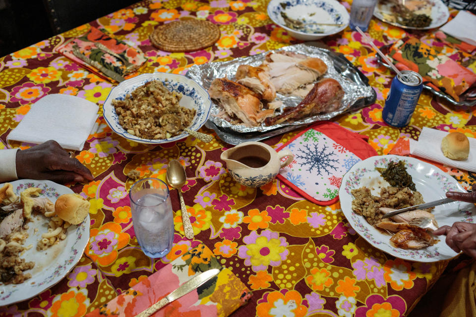 Blanche serves brunch to her 60 year old daughter and husband. On Palm Sunday, traditionally Blanche cooks a big meal for her family. This year, most of her family was too afraid to visit her, in light of Covid-19. With all the extra food, Blanche makes to-go boxes and is delivers them to the neighbors. | Sarah Blesener