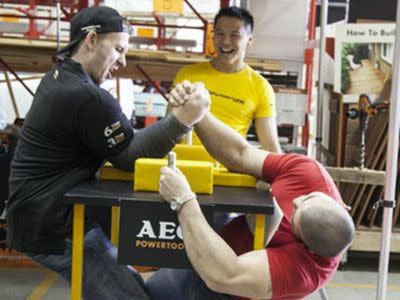 Size is no issue for arm wrestler Matthias Schlitte, left. PIC: Visualeyes Photography Sydney