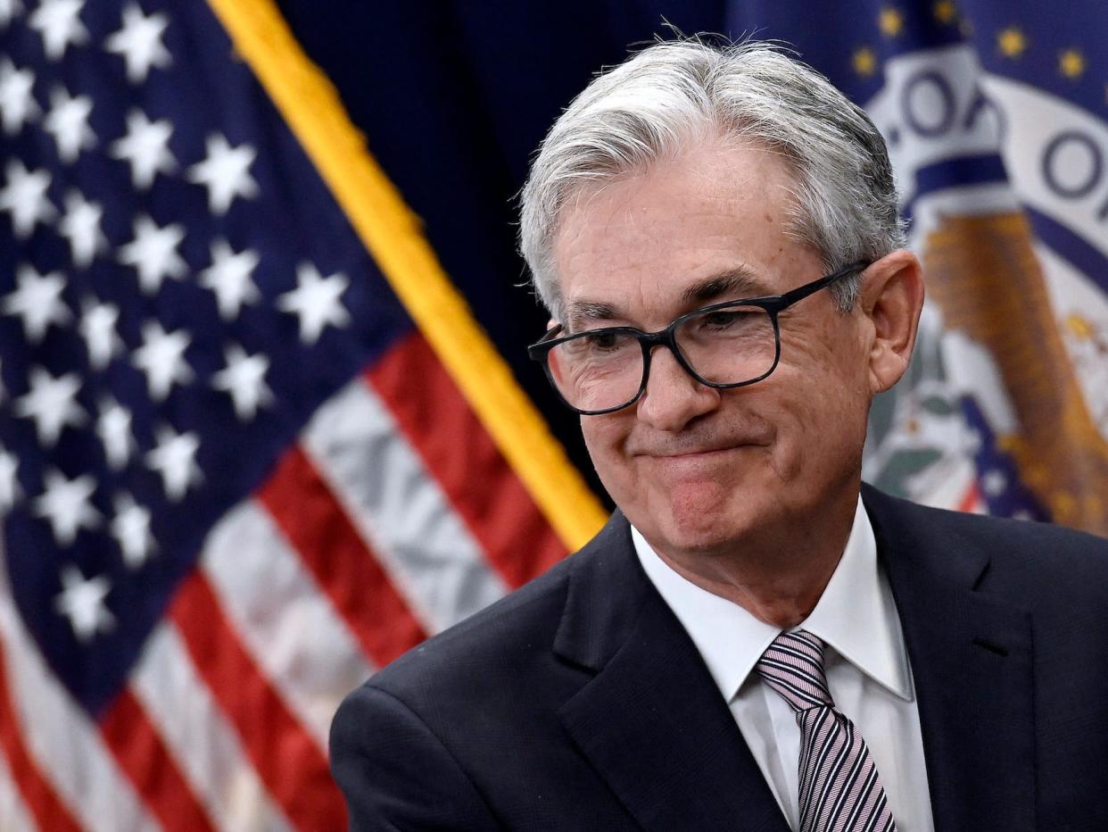 Jerome Powell smiles after taking the oath of office for his second term as Chair of the Board of Governors of the Federal Reserve System at the Federal Reserve Building in Washington, DC, on May 23, 2022.