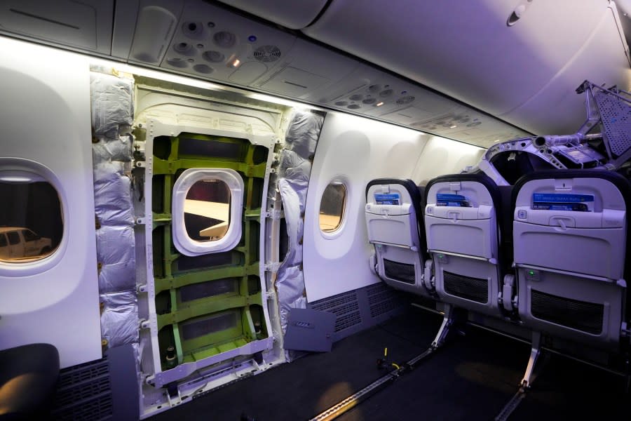 A door plug area of an Alaska Airlines Boeing 737 Max 9, with paneling removed, is shown prior to inspection at Seattle-Tacoma International Airport, Jan. 10, 2024, in SeaTac, Wash. (AP Photo/Lindsey Wasson, File)