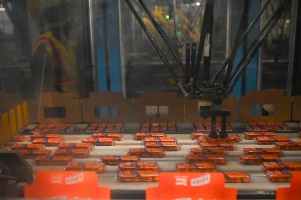 Packaged Toast Chee Lance crackers are sorted and placed in boxes by a machine Nov. 8, 2023, at the Campbell’s Snacks plant in Charlotte.