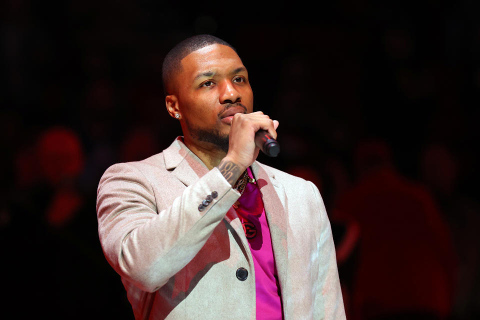 PORTLAND, OREGON - APRIL 10: Damian Lillard #0 of the Portland Trail Blazers speaks to fans during fan appreciation night before the game against the Utah Jazz at Moda Center on April 10, 2022 in Portland, Oregon. NOTE TO USER: User expressly acknowledges and agrees that, by downloading and or using this photograph, User is consenting to the terms and conditions of the Getty Images License Agreement. (Photo by Abbie Parr/Getty Images)