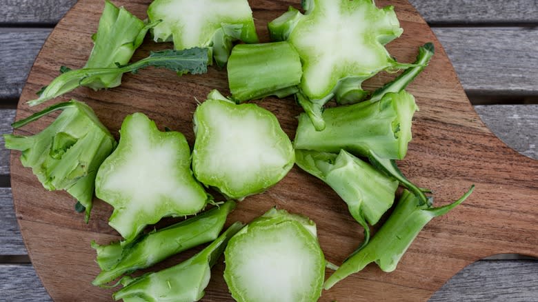 broccoli stems on cutting board