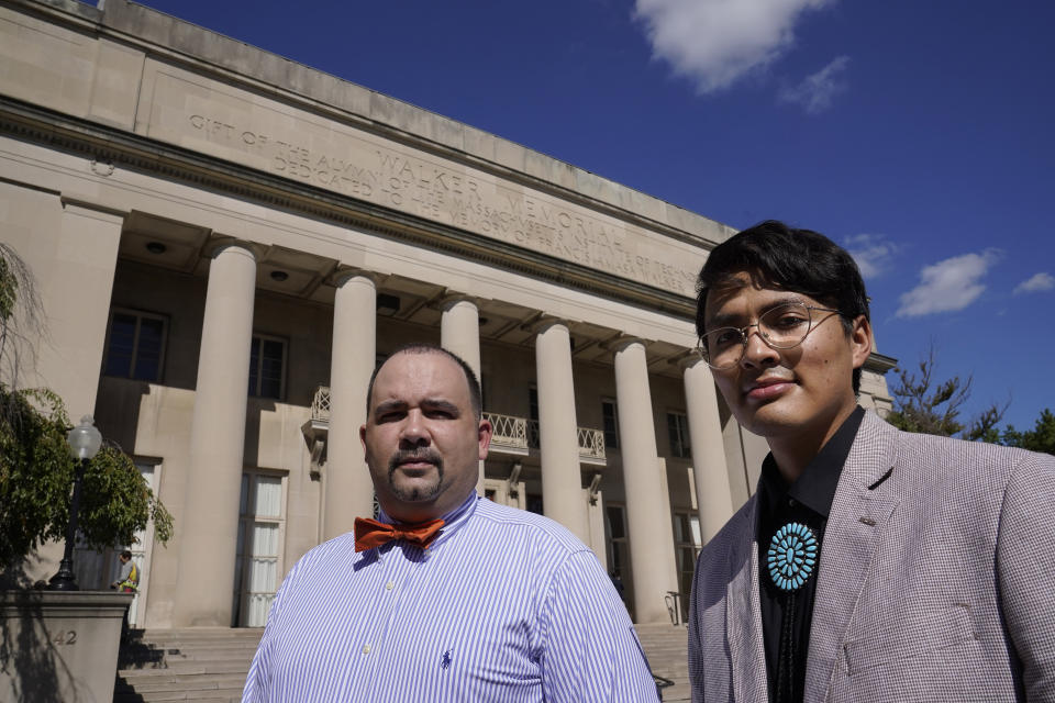 David Shane Lowry, left, distinguished fellow in Native American Studies at Massachusetts Institute of Technology, and Alvin Donel Harvey, president of the MIT Native American Student Association, stand for a photograph, Thursday, Oct. 7, 2021, in front of the Walker Memorial building on the schools campus, in Cambridge, Mass. MIT is grappling with the legacy of one of its founding fathers, whose name graces the iconic building. Francis Amasa Walker was a former head of the U.S. office of Indian Affairs who authored The Indian Question, a notorious treatise on Native Americans that helped justify the nation's tribal reservation system. (AP Photo/Steven Senne)