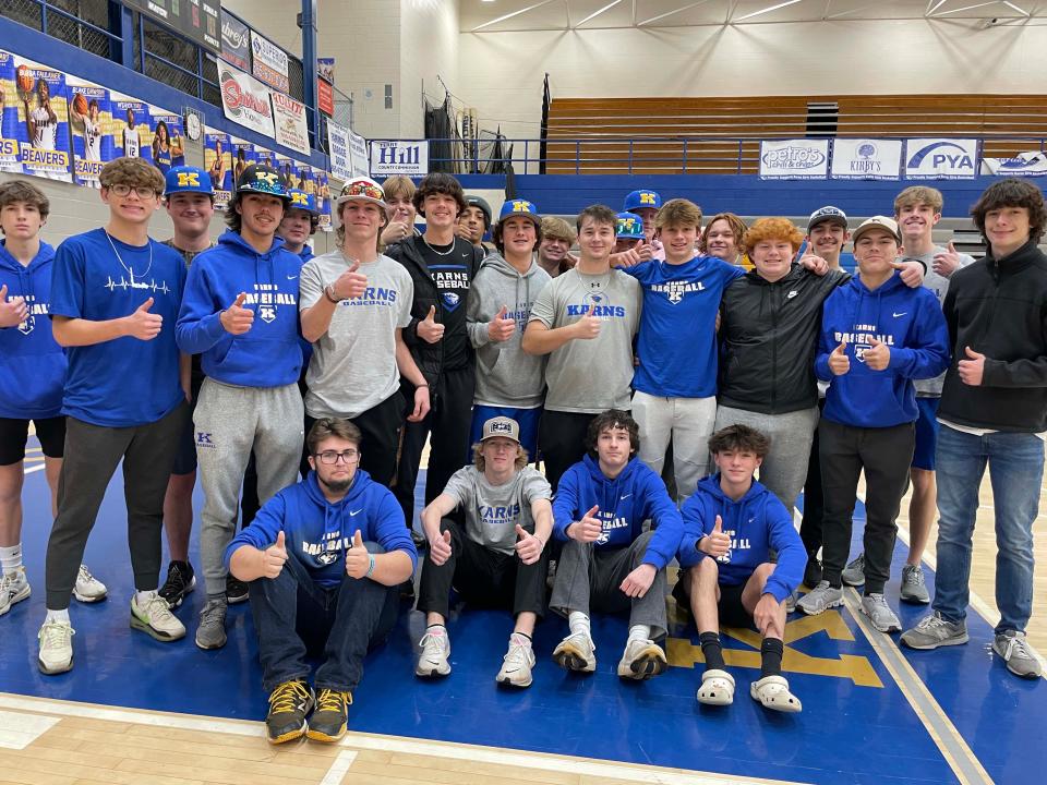 Members of the Karns High School baseball team are ready for a cornhole tournament fundraiser at the school Dec. 17, 2023.