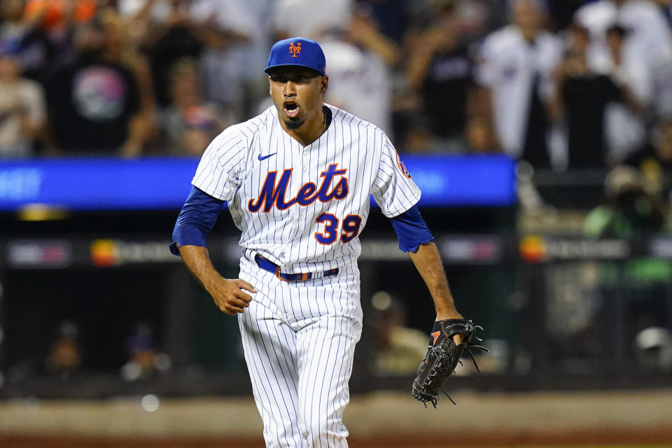 New York Mets relief pitcher Edwin Diaz (39) reacts after a strikeout during the eighth inning of a baseball game against the Colorado Rockies, Thursday, Aug. 25, 2022, in New York. (AP Photo/Frank Franklin II)