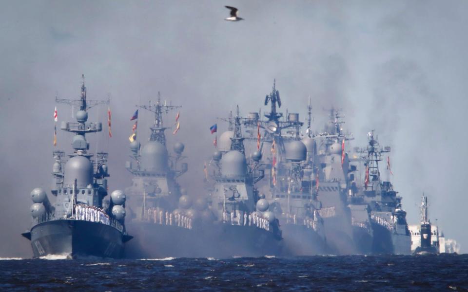 Warships process during the Navy Day parade in Kronstadt, outside St.Petersburg last year - AP Photo/Anton Vaganov, Pool