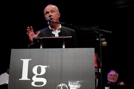 Fredrik Sjoberg of Sweden accepts the 2016 Ig Nobel Prize in Literature for "his three-volume autobiographical work about the pleasures of collecting flies that are dead, and flies that are not yet dead" during the 26th First Annual Ig Nobel Prize ceremony at Harvard University in Cambridge, Massachusetts, U.S. September 22, 2016. REUTERS/Brian Snyder