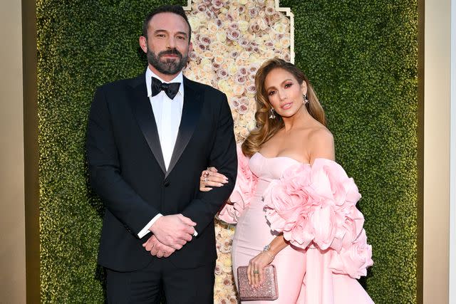 <p>Michael Buckner/Golden Globes 2024/Golden Globes 2024 via Getty</p> Ben Affleck and Jennifer Lopez pose arm in arm at the 2024 Golden Globes in Beverly Hills in January 2024