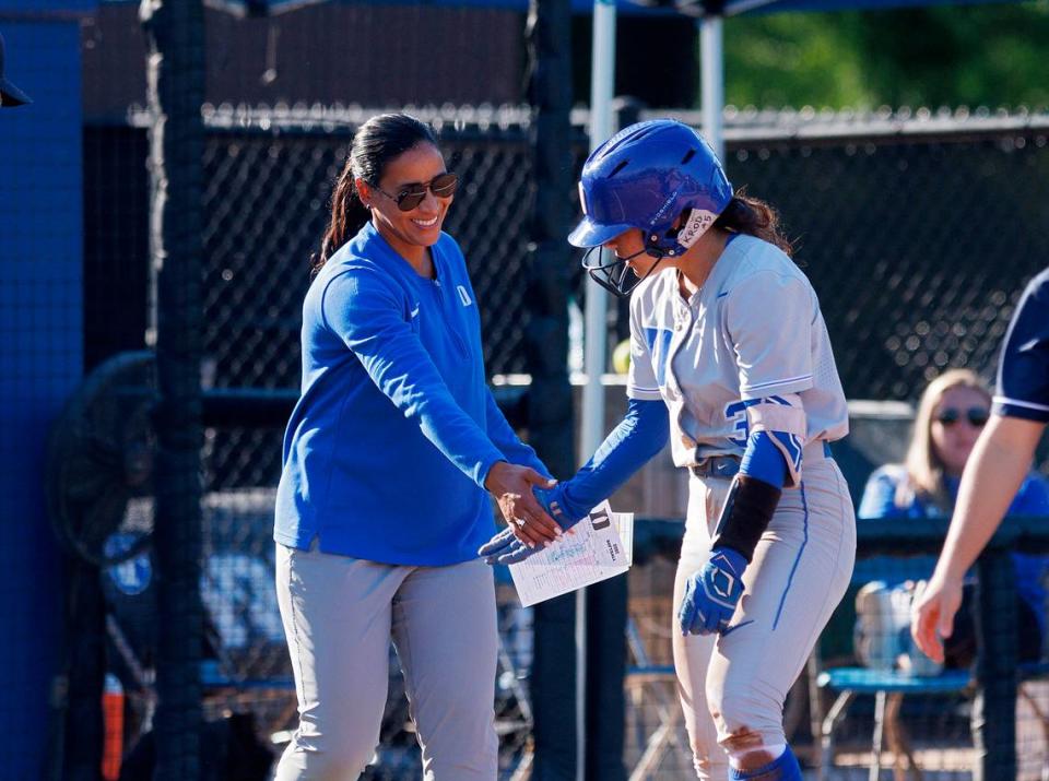 Duke’s Kelly Torres gets a high five from head coach Marissa Young after connecting for a triple during the sixth inning of the Blue Devils’ 6-0 win on Wednesday, April 24, 2024, in Durham, N.C. Kaitlin McKeown/kmckeown@newsobserver.com