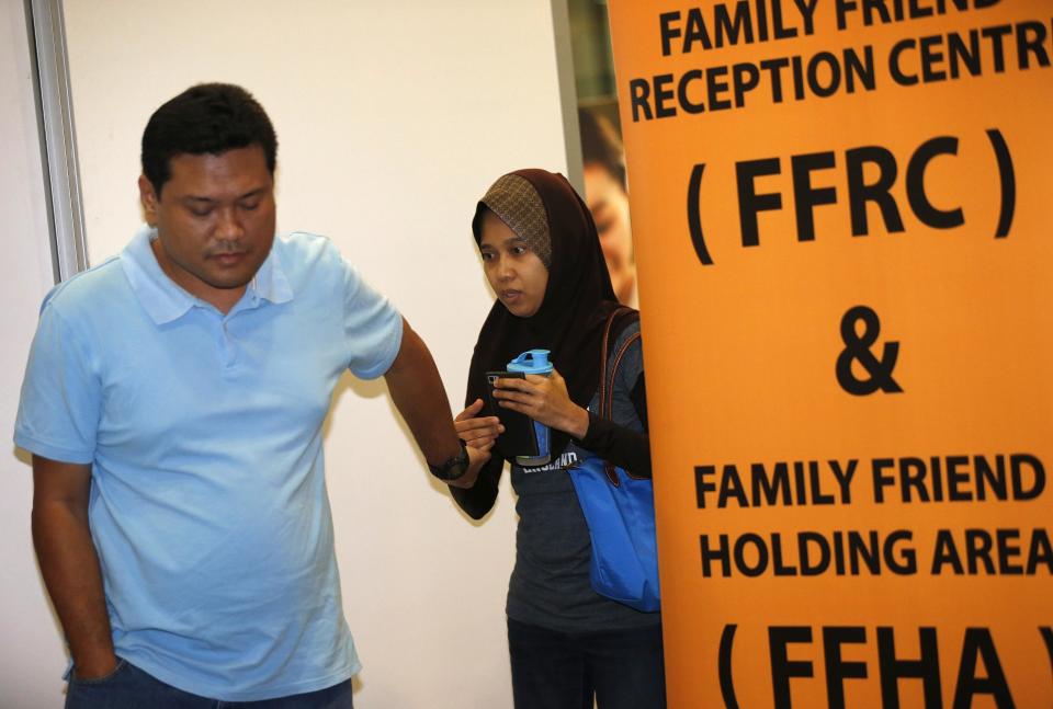 People, who said they believed their relatives were on Malaysia Airlines flight MH17, leave an area designated for family members while waiting for more information about the crashed plane at Kuala Lumpur International Airport in Sepang July 18, 2014. The Malaysia Airlines Boeing 777 was brought down over eastern Ukraine on Thursday, killing all 295 people aboard and sharply raising the stakes in a conflict between Kiev and pro-Moscow rebels in which Russia and the West back opposing sides. REUTERS/Olivia Harris (MALAYSIA - Tags: TRANSPORT DISASTER POLITICS)