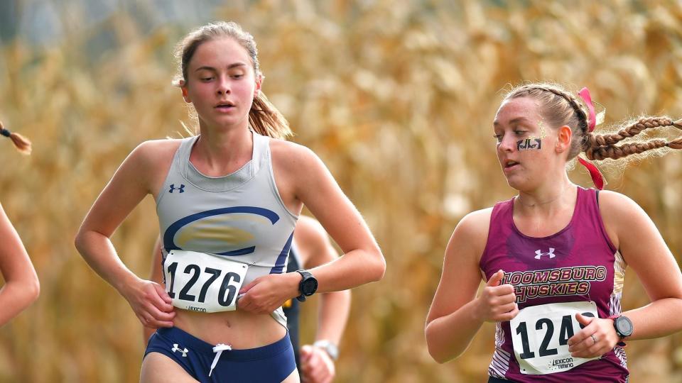 Bloomington North grad Mackenzie Carver (left) runs for the Clarion University women's cross country team. She was a top-five finisher for the Golden Eagles in the conference and regional meets last year.