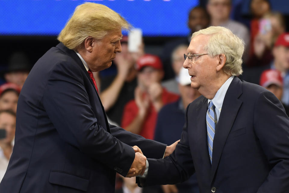 President Donald Trump, left, shakes hands with Senate Majority Leader Mitch McConnell of Ky., as he is brought onstage during a campaign rally in Lexington, Kentucky, Nov. 4, 2019. (Photo: ASSOCIATED PRESS)