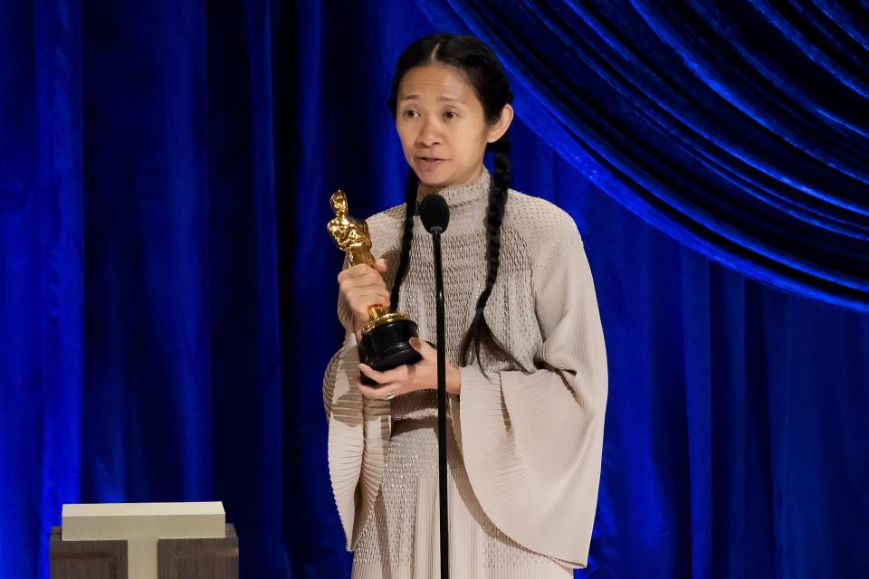 Chloé Zhao accepts best director Oscar for "Nomadland." She's the first woman of color to win the category.
