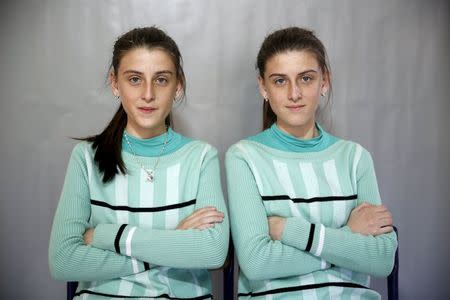 Twins Almedina (L) and Ajla Djulic pose for a portrait in a primary school in Buzim April 10, 2015. REUTERS/Dado Ruvic